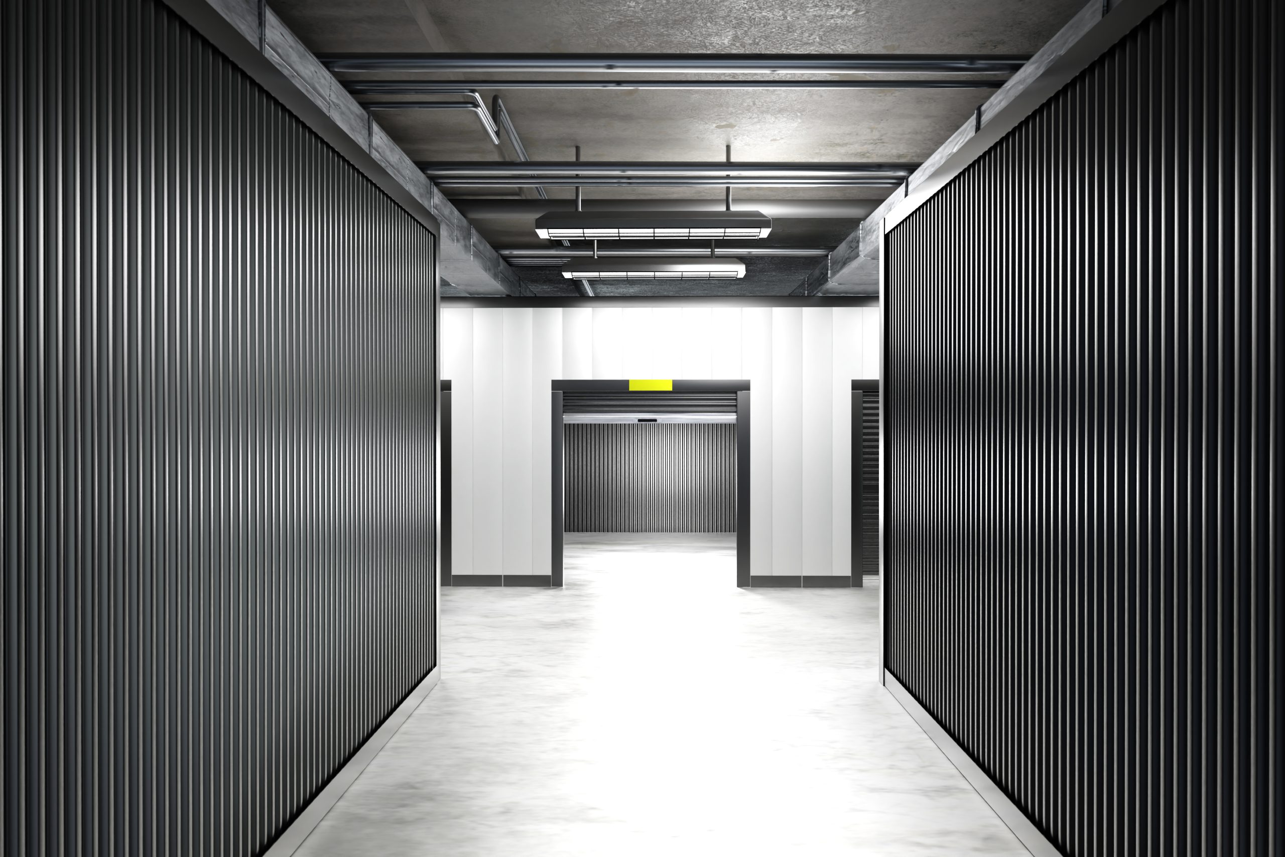Interior of a storage building, showing hallway leading to self storage units showing state of the art facility.